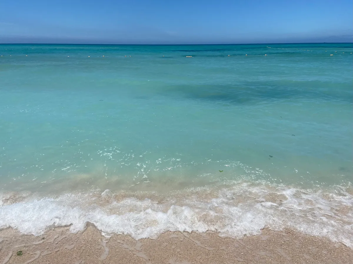 Clear turquoise sea and gentle waves at Gwakji Beach on Jeju Island
