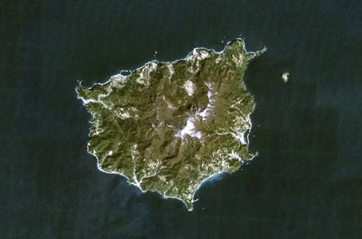 Aerial view of the volcanic island Ulleungdo surrounded by dark blue sea